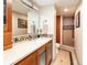 Bathroom with updated vanity, mirror and tiled walk-in shower at 130 N Pearl St # 808, Denver, CO 80203
