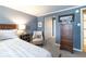 Relaxing bedroom featuring a wooden dresser, neutral walls, and plush carpeting at 130 N Pearl St # 808, Denver, CO 80203