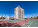 An impressive high rise condo building featuring white balconies is complimented by community tennis courts at 130 N Pearl St # 808, Denver, CO 80203