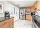 Bright kitchen featuring stainless steel refrigerator, granite countertops and shutters at 130 N Pearl St # 808, Denver, CO 80203