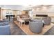 A large seating area features a fireplace, ample seating, a piano and stylish decor at 130 N Pearl St # 808, Denver, CO 80203