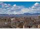 Stunning mountain view above a neighborhood with mix of home and apartment buildings at 130 N Pearl St # 808, Denver, CO 80203