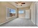 Bedroom with large window offering scenic views and a ceiling fan at 16700 Las Ramblas Ln # O, Parker, CO 80134