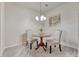 Small dining area with round table and two chairs at 16700 Las Ramblas Ln # O, Parker, CO 80134