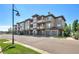 Townhouse building exterior with attached garages and landscaping at 16700 Las Ramblas Ln # O, Parker, CO 80134