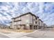 Three story building exterior with stone accents at 16700 Las Ramblas Ln # O, Parker, CO 80134