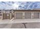 Attached garage, featuring three garage doors and gated entry at 16700 Las Ramblas Ln # O, Parker, CO 80134