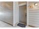 Interior hallway with a grey door and carpeted flooring at 16700 Las Ramblas Ln # O, Parker, CO 80134