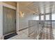 Interior hallway with a grey door and carpeted flooring at 16700 Las Ramblas Ln # O, Parker, CO 80134