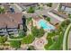 Aerial view of community pool, spa, and surrounding complex at 16700 Las Ramblas Ln # O, Parker, CO 80134