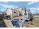 Deck and patio are perfect for outdoor entertaining, featuring a fire pit, grill, and seating at 338 Chelsea St, Castle Rock, CO 80104
