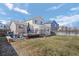 Enjoy outdoor living in the fenced backyard with a deck, patio, and lush lawn at 338 Chelsea St, Castle Rock, CO 80104