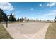 Outdoor basketball court featuring well-maintained surface and hoops, surrounded by trees and open space at 338 Chelsea St, Castle Rock, CO 80104