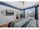 Bright bedroom features a large window for natural light and hardwood floors at 338 Chelsea St, Castle Rock, CO 80104
