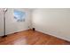 Bedroom with hardwood floors features natural light from the large window at 338 Chelsea St, Castle Rock, CO 80104