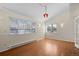 Dining room with hardwood floors, a pendant light, and ample natural light from the windows at 338 Chelsea St, Castle Rock, CO 80104