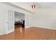 Dining room featuring hardwood floors with an open door leading into the living room at 338 Chelsea St, Castle Rock, CO 80104