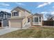 Charming two-story home with attached garage and well-maintained lawn in a suburban neighborhood at 338 Chelsea St, Castle Rock, CO 80104