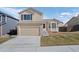 Charming two-story home with attached garage and well-maintained lawn in a suburban neighborhood at 338 Chelsea St, Castle Rock, CO 80104