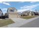 Street view showcasing well-maintained two-story homes with garages and manicured lawns at 338 Chelsea St, Castle Rock, CO 80104
