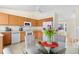 Bright kitchen with stainless steel appliances, tile flooring, and a cozy dining area at 338 Chelsea St, Castle Rock, CO 80104