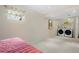 Spacious laundry area includes side by side washer and dryer and convenient shelving for cleaning supplies at 338 Chelsea St, Castle Rock, CO 80104