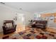 Spacious living room featuring hardwood floors, comfortable leather seating, and an open layout at 338 Chelsea St, Castle Rock, CO 80104
