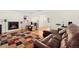Cozy living room features hardwood floors, a fireplace, and comfortable leather seating at 338 Chelsea St, Castle Rock, CO 80104