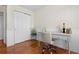 Office with hardwood floors is equipped with a large closet and wainscoting at 338 Chelsea St, Castle Rock, CO 80104