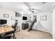 Home office with modern desk, ceiling fan, and treadmill at 11 S Perry St, Denver, CO 80219