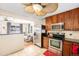 Open kitchen layout showcasing stainless steel appliances and seamless flow into the living area at 11 S Perry St, Denver, CO 80219