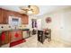 Bright kitchen boasts stainless steel appliances, wooden cabinets, and tiled flooring at 11 S Perry St, Denver, CO 80219