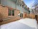 Private backyard patio, partially covered, with snow on the ground at 3850 Paseo Del Prado # 7, Boulder, CO 80301