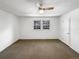 Bright bedroom with neutral carpeting and ceiling fan at 3850 Paseo Del Prado # 7, Boulder, CO 80301