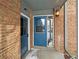 Front entrance with blue door and brick facade at 3850 Paseo Del Prado # 7, Boulder, CO 80301