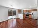 Eat-in kitchen with hardwood floors and sliding glass door to backyard at 3850 Paseo Del Prado # 7, Boulder, CO 80301