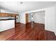 Open concept kitchen and dining area with stainless steel appliances and hardwood floors at 3850 Paseo Del Prado # 7, Boulder, CO 80301