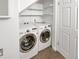 Laundry room with washer, dryer, and shelving at 3850 Paseo Del Prado # 7, Boulder, CO 80301