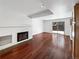 Living room with hardwood floors, fireplace and sliding glass door at 3850 Paseo Del Prado # 7, Boulder, CO 80301