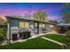 Serene backyard featuring a lush green lawn, patio and seating at 2252 Lamar St, Edgewater, CO 80214