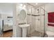 Bathroom featuring a glass-enclosed shower, modern vanity, and stylish fixtures at 2252 Lamar St, Edgewater, CO 80214