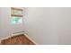 Bedroom featuring wood floors and a window with natural light at 2252 Lamar St, Edgewater, CO 80214