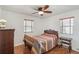 Cozy bedroom with hardwood floors, ceiling fan, and decorative quilt at 2252 Lamar St, Edgewater, CO 80214