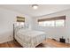 Bright bedroom with hardwood floors, window with bamboo blinds, and a comfortable bed at 2252 Lamar St, Edgewater, CO 80214
