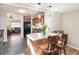 Open kitchen with breakfast bar featuring granite countertops and stylish pendant lighting at 2252 Lamar St, Edgewater, CO 80214