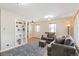 Bright living room with hardwood floors, built-in shelves, and a comfortable seating area at 2252 Lamar St, Edgewater, CO 80214