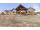 This backyard features a covered patio with outdoor seating, perfect for relaxing and enjoying the peaceful surroundings at 7398 Weaver Cir, Castle Rock, CO 80104