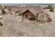 Backyard featuring a spacious patio area ideal for outdoor dining and entertaining, overlooking the property's natural beauty at 7398 Weaver Cir, Castle Rock, CO 80104