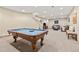 Finished basement featuring a pool table, a seating area with leather sofas, and neutral carpet at 7398 Weaver Cir, Castle Rock, CO 80104
