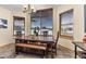 Bright dining room featuring a large bay window with views of the snowy outdoors at 7398 Weaver Cir, Castle Rock, CO 80104